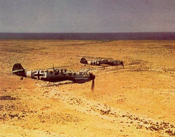 Messerschmitt_bf_109e-7_trop_color_JG27_over_desert.jpg